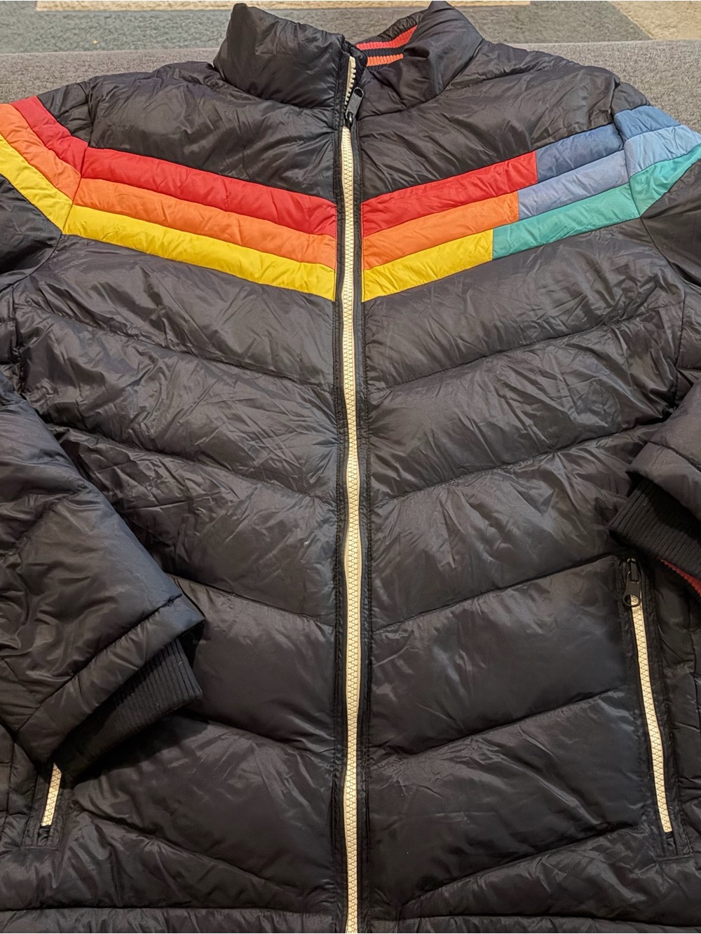 Marine Layer Zurich Black Puffer Jacket with Rainbow Chevron Stripes